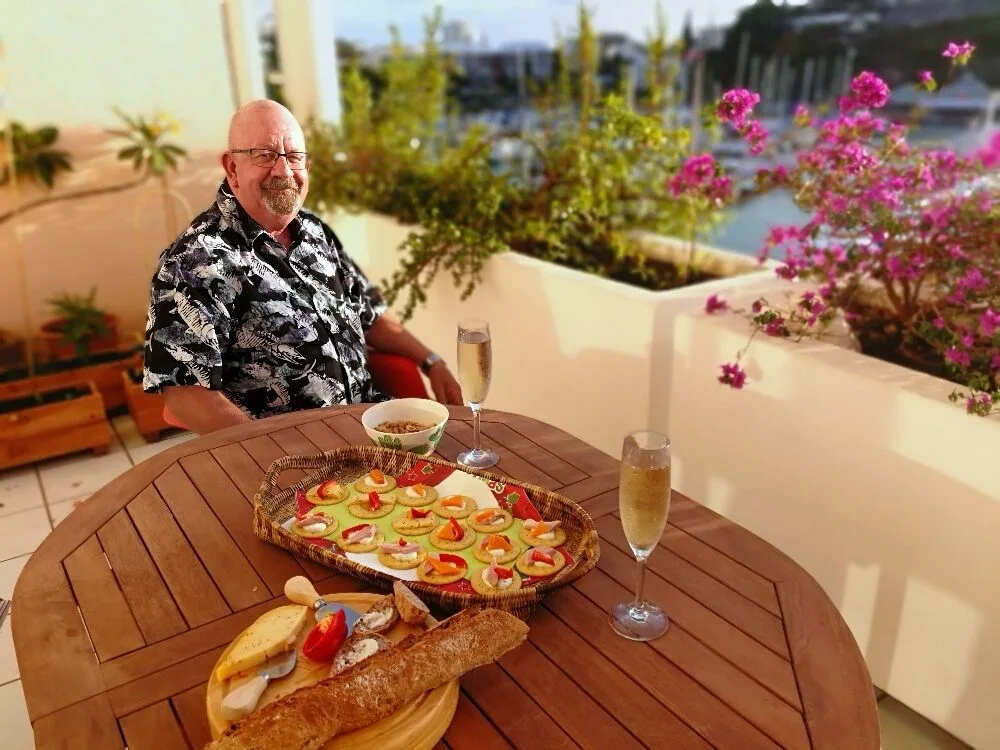 A person sitting at a table with food on it

AI-generated content may be incorrect.