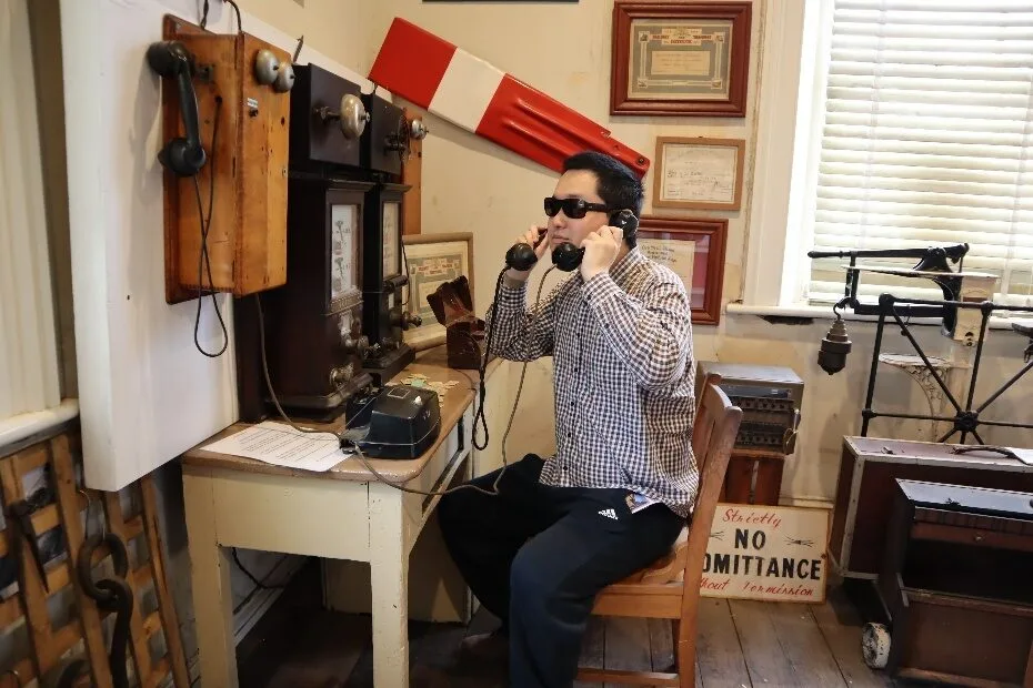 A person sitting in a chair with headphones on
AI-generated content may be incorrect.