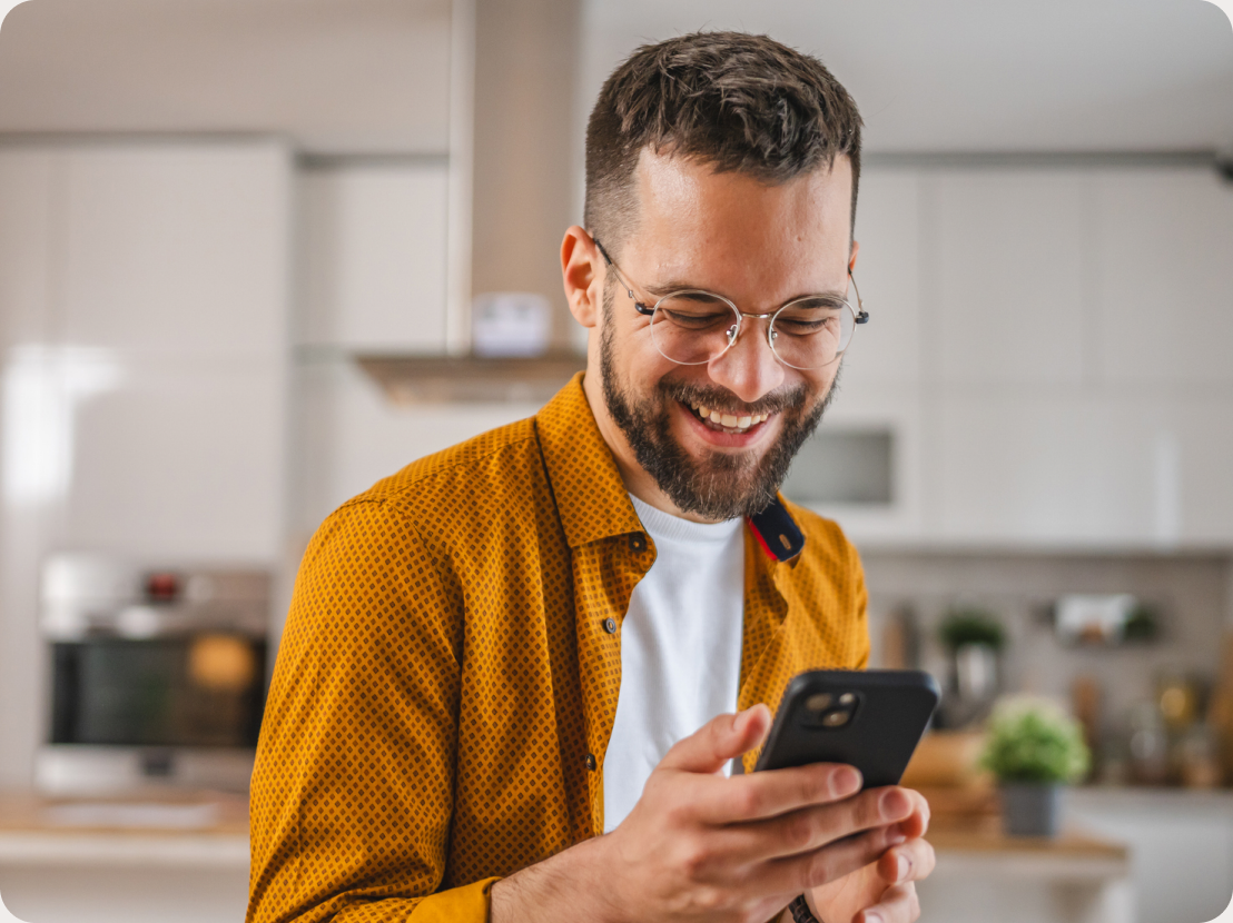 Smiling woman holding a phone